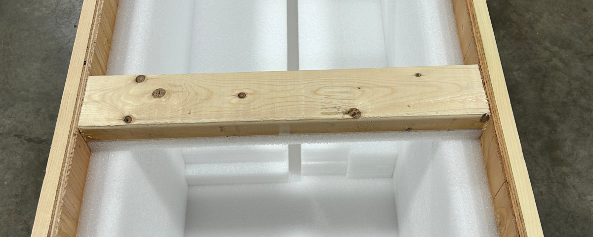 This is an image of a custom crate that is designed to hold a vertical object.