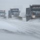 snow plows clearing a highway
